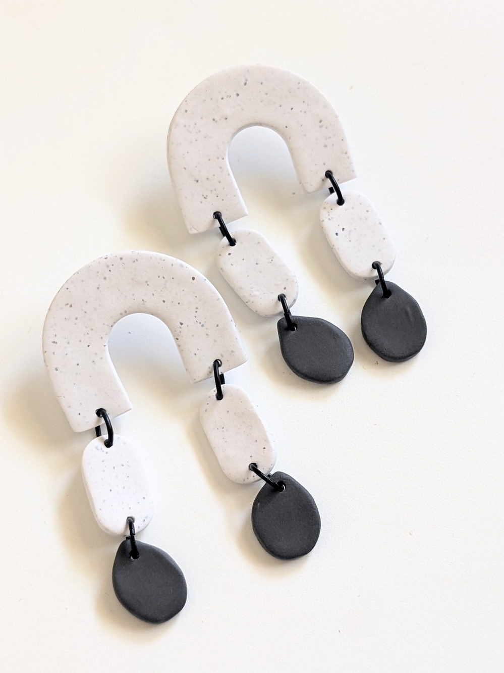 Geometric White and Black Dangle Arch Earrings